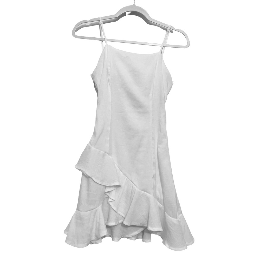 White sundress with tie back and flowy ruffle bottom